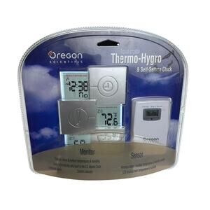 Oregon scientific liquid crystal Thermo Hygro and self setting clock